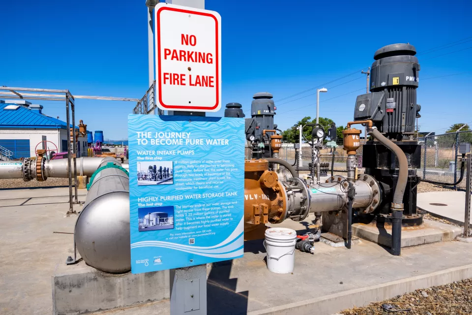 Sign about water purification process mounted on water treatment plant in Santa Clara, California